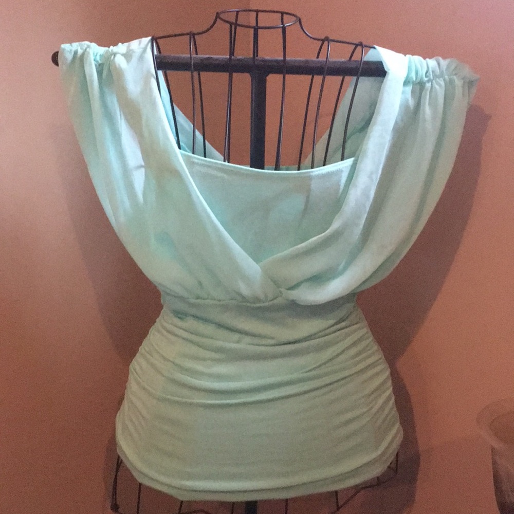 Maurice’s mint color sheer blouse.